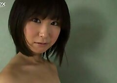 Whorish japoneză fata yumi ishikaw poses on a camera wearing ripped off top